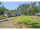 The house has an expansive backyard with mature trees at 9226 Dan Lynn St, Brooksville, FL 34601