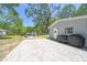 Paver patio with outdoor seating and two black grills at 9226 Dan Lynn St, Brooksville, FL 34601