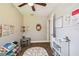 Bright bedroom featuring wood-look floors, ceiling fan, and -friendly décor at 9226 Dan Lynn St, Brooksville, FL 34601