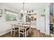 Bright dining room with wood floors and an eat-in kitchen featuring stainless steel appliances at 9226 Dan Lynn St, Brooksville, FL 34601