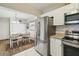 Bright eat-in kitchen with stainless steel appliances and a dining area at 9226 Dan Lynn St, Brooksville, FL 34601