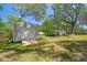 Backyard shed with roll-up door and ramp at 9226 Dan Lynn St, Brooksville, FL 34601