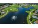 Aerial view of a lake and golf course surrounded by homes in a beautiful community at 1006 Sweet Jasmine Dr, Trinity, FL 34655