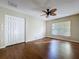 Bedroom featuring hardwood floors, closet, and natural light at 1006 Sweet Jasmine Dr, Trinity, FL 34655