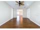 Bedroom with hardwood floors, ceiling fan, and a closet at 1006 Sweet Jasmine Dr, Trinity, FL 34655