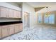 Dining room with custom cabinets, marble floors, and plantation shutters at 1006 Sweet Jasmine Dr, Trinity, FL 34655