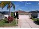 Charming single-story home with a well-manicured lawn, a large two-car garage, and a neutral color scheme at 1006 Sweet Jasmine Dr, Trinity, FL 34655