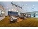 Multipurpose room featuring a stage and an extended set of tables and chairs at 1006 Sweet Jasmine Dr, Trinity, FL 34655