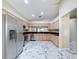 Spacious kitchen with stainless steel appliances and marble floors at 1006 Sweet Jasmine Dr, Trinity, FL 34655