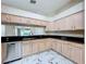 Kitchen featuring granite countertops and stainless steel appliances at 1006 Sweet Jasmine Dr, Trinity, FL 34655