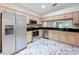 Kitchen featuring stainless steel appliances and marble floors at 1006 Sweet Jasmine Dr, Trinity, FL 34655
