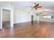 Expansive living area featuring hardwood floors and access to multiple rooms for seamless entertaining at 1006 Sweet Jasmine Dr, Trinity, FL 34655