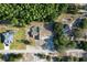 Aerial view of a single-story home with landscaped front yard and a circular driveway at 10228 Beechcraft St, New Port Richey, FL 34654
