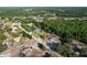 Aerial view of a quiet neighborhood with well-maintained homes and tree-lined streets at 10228 Beechcraft St, New Port Richey, FL 34654