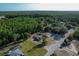 Aerial view showcasing a home with a private backyard bordering a lush forest at 10228 Beechcraft St, New Port Richey, FL 34654