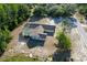 Aerial view of a quaint home featuring a screened pool and private backyard at 10228 Beechcraft St, New Port Richey, FL 34654
