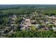 Expansive aerial view showcasing the neighborhood's lush greenery and spacious lots at 10228 Beechcraft St, New Port Richey, FL 34654