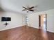 Spacious bedroom featuring hardwood floors and a ceiling fan at 10228 Beechcraft St, New Port Richey, FL 34654