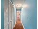 Hallway with hard wood floors and view to the rooms at 10228 Beechcraft St, New Port Richey, FL 34654