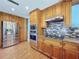Spacious kitchen with stainless steel appliances and granite countertops at 10228 Beechcraft St, New Port Richey, FL 34654