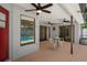 A cozy covered patio with ceiling fans and view of the inviting pool, perfect for outdoor relaxation and entertainment at 11353 Norvell Rd, Spring Hill, FL 34608