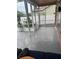 Enclosed patio boasting serene outdoor views and versatile space for relaxation or entertaining at 12040 Penzance Ln, New Port Richey, FL 34654