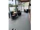 Cozy screened patio featuring comfortable wicker furniture and a peaceful outdoor lounge area at 12040 Penzance Ln, New Port Richey, FL 34654