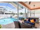 Relaxing screened in pool area, with comfortable outdoor seating and hot tub perfect for entertaining guests or Gathering time at 12040 Penzance Ln, New Port Richey, FL 34654
