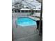 The refreshing screened pool area is perfect for leisure and recreation, offering a relaxing outdoor experience at 12040 Penzance Ln, New Port Richey, FL 34654
