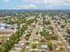 Wide aerial view of a community with mature trees and clear neighborhood streets at 13052 Drysdale St, Spring Hill, FL 34609