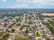 Expansive aerial view of a community with mature trees and an in-ground pool at 13052 Drysdale St, Spring Hill, FL 34609