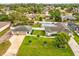 Aerial view of a backyard with in-ground pool and an oversized detached garage at 13052 Drysdale St, Spring Hill, FL 34609