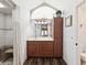 Bright bathroom with wood floors, cabinetry, shower, vanity, and decor at 13052 Drysdale St, Spring Hill, FL 34609