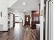 Inviting foyer featuring wood-look floors, an elegant front door, and a built-in storage cabinet at 13052 Drysdale St, Spring Hill, FL 34609