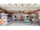 Large garage with exposed ceiling and storage, providing ample space for vehicles and equipment at 13052 Drysdale St, Spring Hill, FL 34609