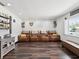 Comfortable living room with recliner seating, wood-look floors and a view from the window at 13052 Drysdale St, Spring Hill, FL 34609