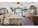 Comfortable main bedroom featuring access to the pool deck and a full dresser at 13052 Drysdale St, Spring Hill, FL 34609