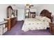 Inviting main bedroom with carpet flooring, wood furniture and bright natural light at 13052 Drysdale St, Spring Hill, FL 34609