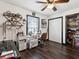 Bright office space with wood floors, a sewing machine, large closet, and built-in storage shelves at 13052 Drysdale St, Spring Hill, FL 34609
