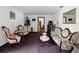 Classic sitting room with carpet flooring featuring vintage furniture and decor at 13052 Drysdale St, Spring Hill, FL 34609