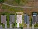 Birds-eye view of a home with a well-maintained roof and a manicured lawn, surrounded by neighboring properties at 13618 Niti Dr, Hudson, FL 34669