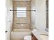 Bathroom with tiled shower and grab bar at 13618 Niti Dr, Hudson, FL 34669