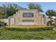 Elegant community sign featuring a water feature, lush greenery and 'The Reserve' lettering at 13618 Niti Dr, Hudson, FL 34669