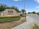 Community entrance sign showcasing a decorative water feature at 13618 Niti Dr, Hudson, FL 34669