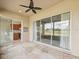 Open patio featuring sliding glass doors leading to the kitchen and decorative concrete flooring at 13618 Niti Dr, Hudson, FL 34669