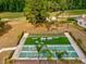 An aerial view of shuffleboard courts surrounded by a lush green landscape at 13618 Niti Dr, Hudson, FL 34669