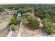 Aerial view of a beautiful home and large lot surrounded by lush trees and landscaping at 14545 Battenwood Dr, Spring Hill, FL 34610
