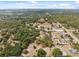 Overhead view showing diverse neighborhood with mature trees and a few residences at 14545 Battenwood Dr, Spring Hill, FL 34610