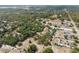 Expansive aerial view of a wooded neighborhood featuring varied terrains at 14545 Battenwood Dr, Spring Hill, FL 34610