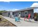 Backyard patio with outdoor seating and potted plants, perfect for relaxation and entertaining at 14545 Battenwood Dr, Spring Hill, FL 34610